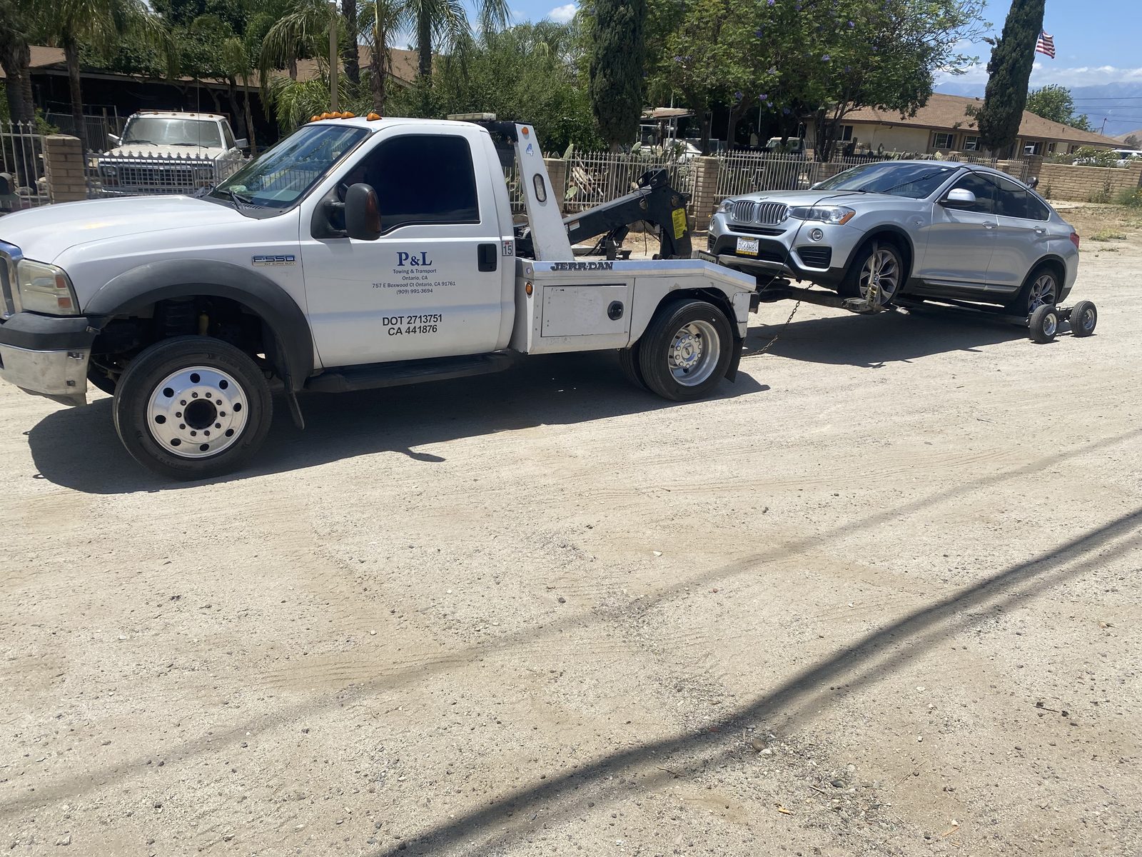 P&L Towing wheel-lift truck recovering an SUV in Ontario, CA